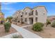 Townhouse exterior with walkway and landscaping at 4604 Dover Straight St, Las Vegas, NV 89115