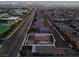 Aerial view of a house and surrounding neighborhood at dusk at 6877 Painted Morning Ave, Las Vegas, NV 89142