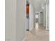 Bright hallway with access to laundry and other rooms at 694 Riverband Pl, Henderson, NV 89052