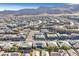 Aerial view of a luxury community with upscale homes and mountain views at 10150 Emerald Sunset Ct, Las Vegas, NV 89148