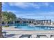 Relaxing resort-style pool with lounge chairs and patio tables at 10150 Emerald Sunset Ct, Las Vegas, NV 89148