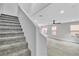 Gray carpeted staircase leading to upper level at 10731 Mason Hill Ave, Las Vegas, NV 89166