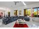 Bright living room with large windows and stylish furniture at 11008 Mission Lakes Ave, Las Vegas, NV 89134