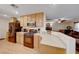 Bright kitchen with stainless steel appliances and an island for additional workspace at 11734 Bergamo Ct, Las Vegas, NV 89183