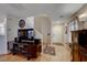 Living room with hardwood floors, a TV, and a staircase at 11734 Bergamo Ct, Las Vegas, NV 89183