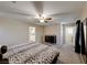 Main bedroom with leopard print bedding and ensuite bath at 11734 Bergamo Ct, Las Vegas, NV 89183