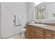 Well-appointed bathroom featuring granite vanity and tiled shower at 20 Via Visione # 104, Henderson, NV 89011