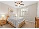 Cozy bedroom with wood-look flooring and a light gray comforter at 2238 Thelen Ave, North Las Vegas, NV 89086