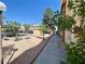 Well-maintained complex with walkway, landscaping, and parking at 3842 Soda Springs Dr, Las Vegas, NV 89115