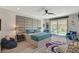 Spacious main bedroom with an upholstered wall, ensuite bathroom, and sliding glass doors leading to the pool at 41 Sun Mirage Ave, Henderson, NV 89011