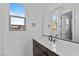 Modern bathroom with a clean vanity and dark brown cabinets at 437 Cascade Heights Ave, Las Vegas, NV 89138