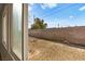 View of backyard with gravel and block wall at 4521 Harmon Cir, Las Vegas, NV 89122