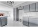 Gray kitchen cabinets and stainless steel appliances at 5815 Christchurch Ave, Las Vegas, NV 89110