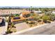 Aerial view of house featuring solar panels, landscaped yard, and a two-car garage at 6618 Turina Rd, Las Vegas, NV 89146