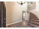 Elegant entryway with a curved staircase and hardwood floors at 6618 Turina Rd, Las Vegas, NV 89146