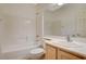 Clean bathroom with a tub, shower, and light wood vanity at 10563 Premia Pl, Las Vegas, NV 89135