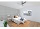 Spacious bedroom with wood-look floors and stylish gray accent wall at 1932 Misty Glade Dr, Las Vegas, NV 89119