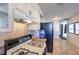 Kitchen with white cabinets, granite countertops and gas stove top at 2016 Embrey Ave, Las Vegas, NV 89106