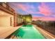 Relaxing pool and spa with water features and beautiful sunset at 2024 Orchard Mist St, Las Vegas, NV 89135