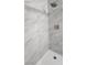 Clean shower with marble-look wall tiles and a modern shower head at 2041 Kearney St, Pahrump, NV 89048