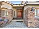 Entrance with double doors and stone facade at 255 El Camino Verde St, Henderson, NV 89074