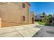 Large patio area adjacent to a two-story house with artificial turf at 2815 Athens Ridge Dr, Henderson, NV 89052