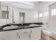 Bathroom with double sinks, granite countertop, and bathtub at 3304 Oeste Vista St, Las Vegas, NV 89129