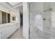 Bathroom with double sinks, marble vanity, and a separate shower at 363 Rushing Creek Ct, Henderson, NV 89014