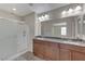 Bathroom with double vanity, granite countertop, and shower at 366 Ambitious St, Henderson, NV 89011