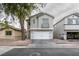 Two-story house with attached garage and balcony at 4365 Raynham St, Las Vegas, NV 89115