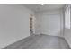 Bedroom with grey floor, white walls, and access to closet and hallway at 4432 Halbert Ave, Las Vegas, NV 89110