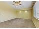 Empty bedroom with ceiling fan and large window at 6086 Shadow Oak Dr, North Las Vegas, NV 89031