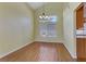 Bright dining room with hardwood floors and a large window at 6086 Shadow Oak Dr, North Las Vegas, NV 89031