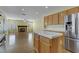 Open kitchen with island and stainless steel appliances at 6086 Shadow Oak Dr, North Las Vegas, NV 89031