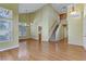 Spacious living room with hardwood floors and staircase at 6086 Shadow Oak Dr, North Las Vegas, NV 89031