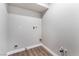 Small laundry room with hookups and wood-look flooring at 700 Connie Dr, Las Vegas, NV 89107