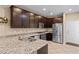 Modern kitchen with stainless steel appliances and granite countertops at 7253 Sterling Rock Ave, Las Vegas, NV 89178