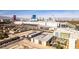 Aerial view of a Las Vegas neighborhood, showing a modern hotel and large parking areas at 730 S Royal Crest Cir # 426, Las Vegas, NV 89169