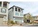 Three-story home with gray exterior and a two-car garage at 8040 Mercury Skye St, Las Vegas, NV 89166