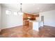 Kitchen with island, wood cabinets, and tile flooring at 9343 Oxbow Lake Ave, Las Vegas, NV 89149