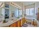 Double vanity bathroom with soaking tub and separate shower at 10017 Snow Crest Pl, Las Vegas, NV 89134