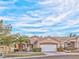 Single-story house with a two-car garage and desert landscaping at 10017 Snow Crest Pl, Las Vegas, NV 89134