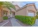 House exterior featuring walkway and lush green hedges at 10017 Snow Crest Pl, Las Vegas, NV 89134