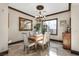 Elegant dining room featuring a wood table and chandelier at 10254 Sofferto Ave, Las Vegas, NV 89135