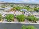 Aerial view of houses with solar panels and lush landscaping at 10554 Cloud Whisper Dr, Las Vegas, NV 89135