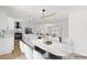 Modern dining area with a marble table and white chairs at 110 Palo Verde Dr, Henderson, NV 89015