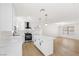 Modern white kitchen with island and stainless steel appliances at 110 Palo Verde Dr, Henderson, NV 89015