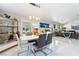 Bright dining room with modern table and chairs, looking into living room at 1110 Azure Heights Pl, Las Vegas, NV 89110