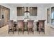 Modern kitchen featuring an island, stainless steel appliances, and hardwood floors at 11775 Woodbrook Ct, Las Vegas, NV 89141