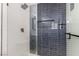 Modern bathroom with white and dark blue tiles and glass shower at 1408 S 16Th St, Las Vegas, NV 89104